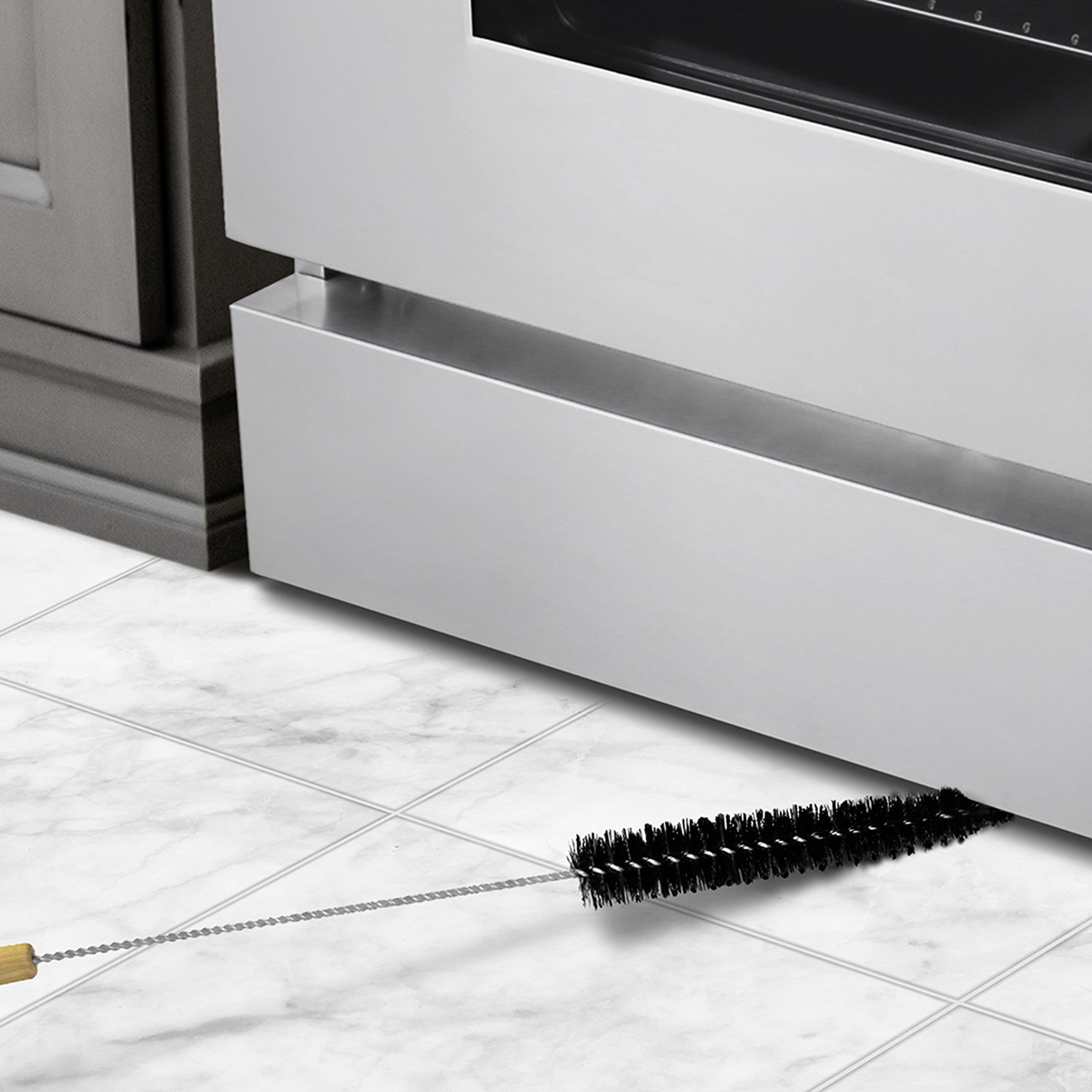 Clean out from under your appliances with a specialized appliance brush